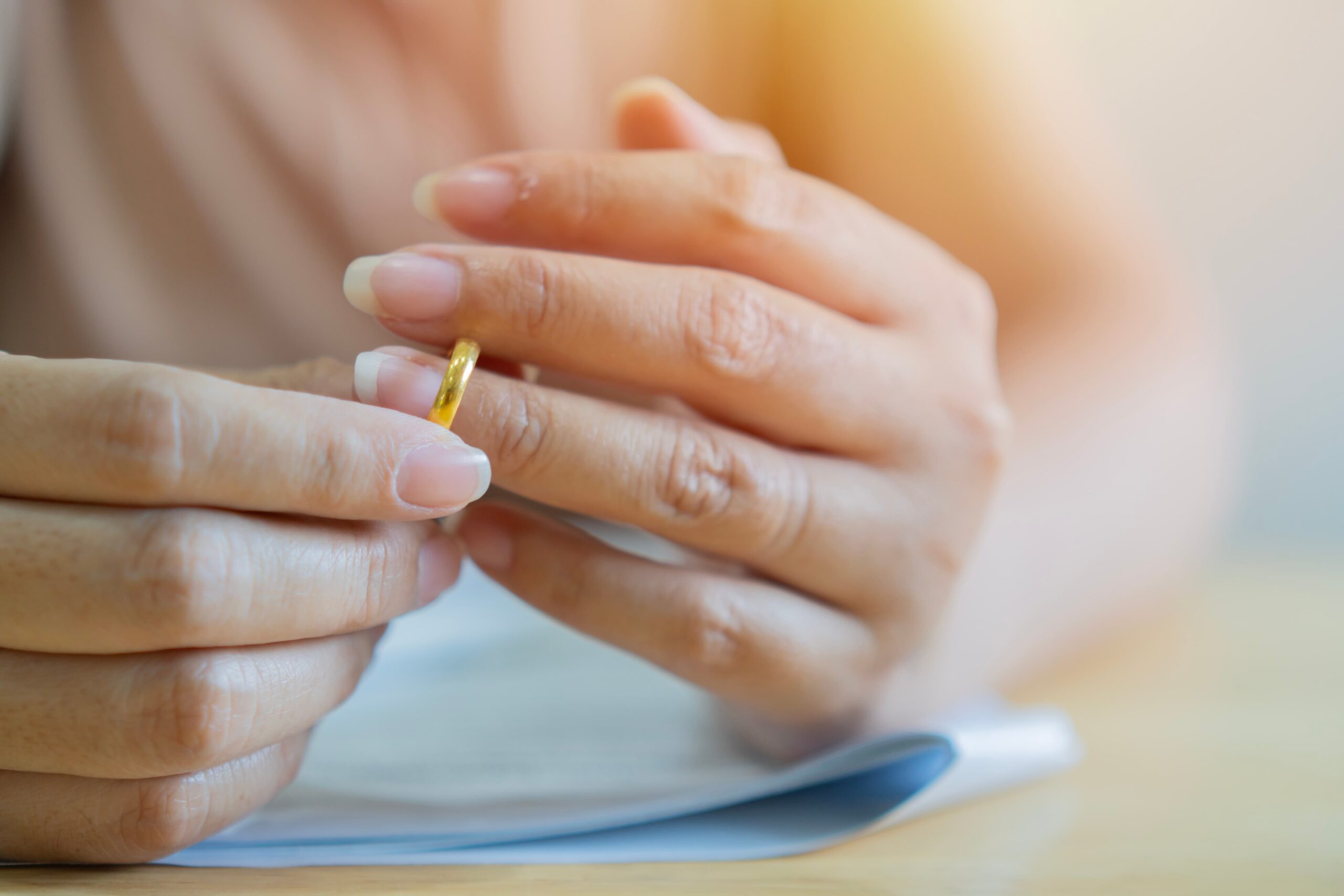 close-up-of-woman-taking-ring-off-her-hand