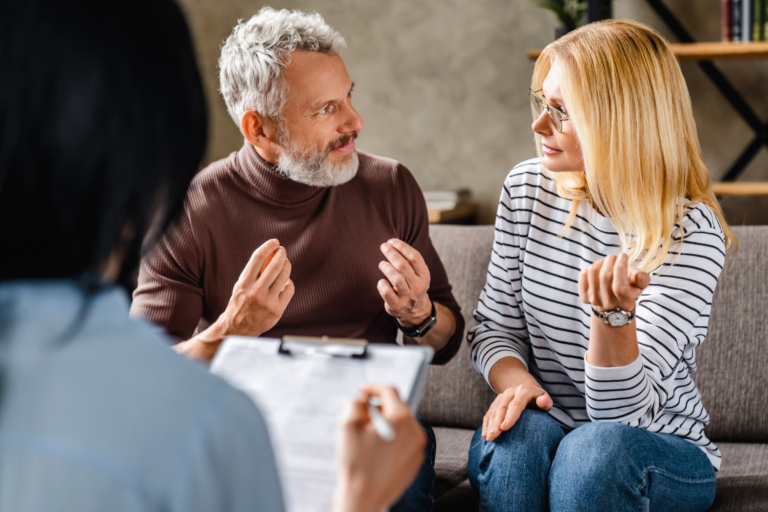 divorcing-couple-in-mediation-session-talking-to-each-other