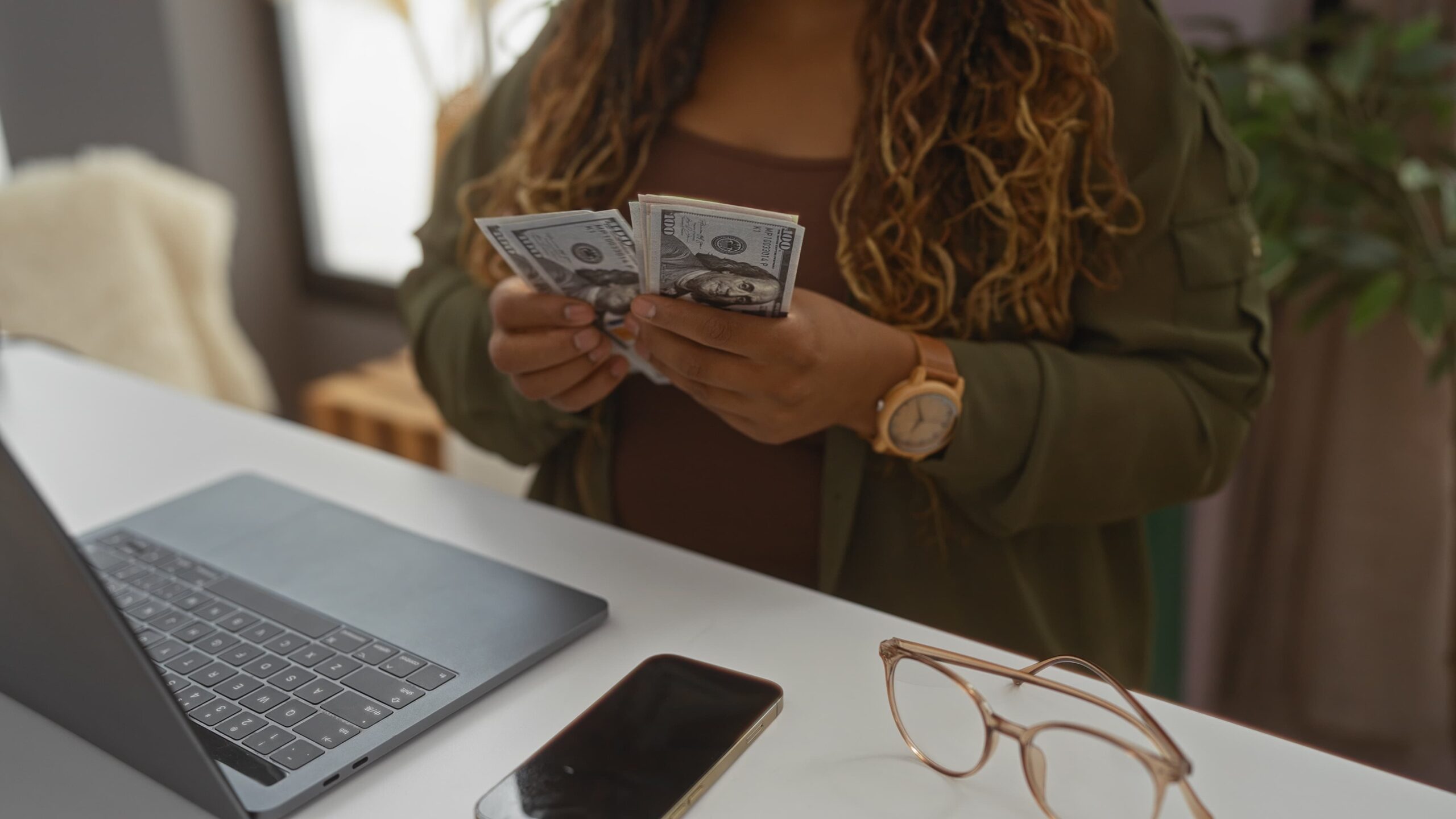 woman-counting-money-at-home